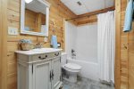 Basement Bathroom with a Tub Shower Combo 